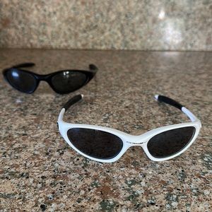 2 set of Oakley sunglasses - white and black pair